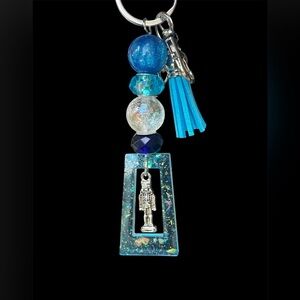 Blue Beaded Keychain with Nutcracker Charm inside a resin frame. Handmade